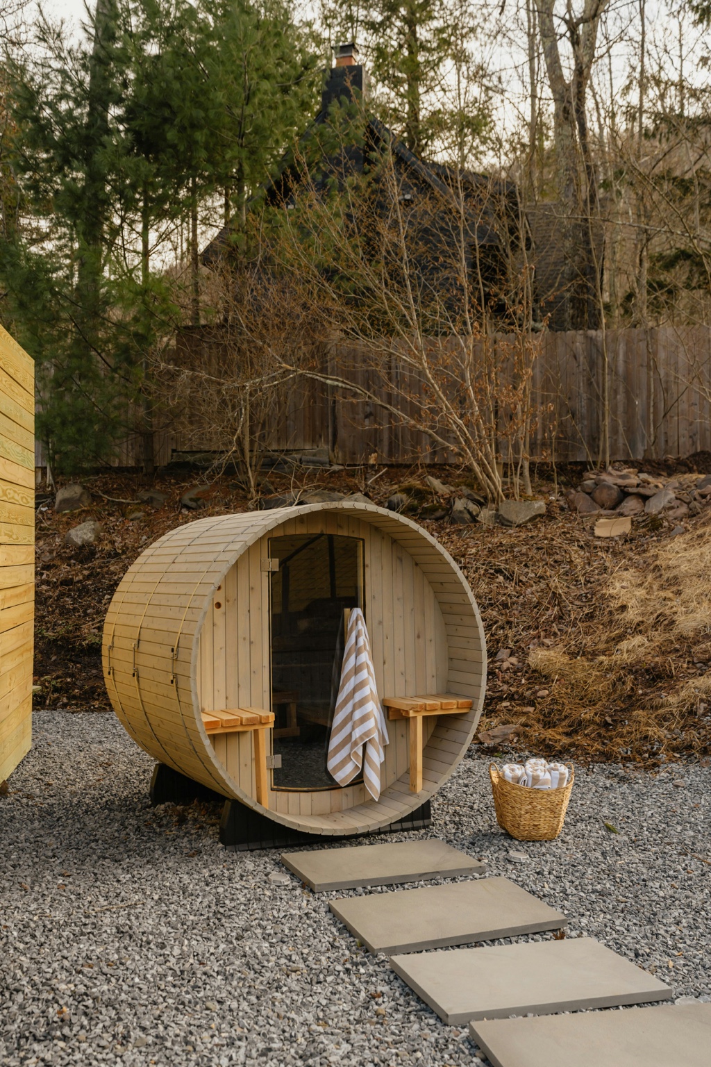 Outdoor backyard barrel sauna on gravel base