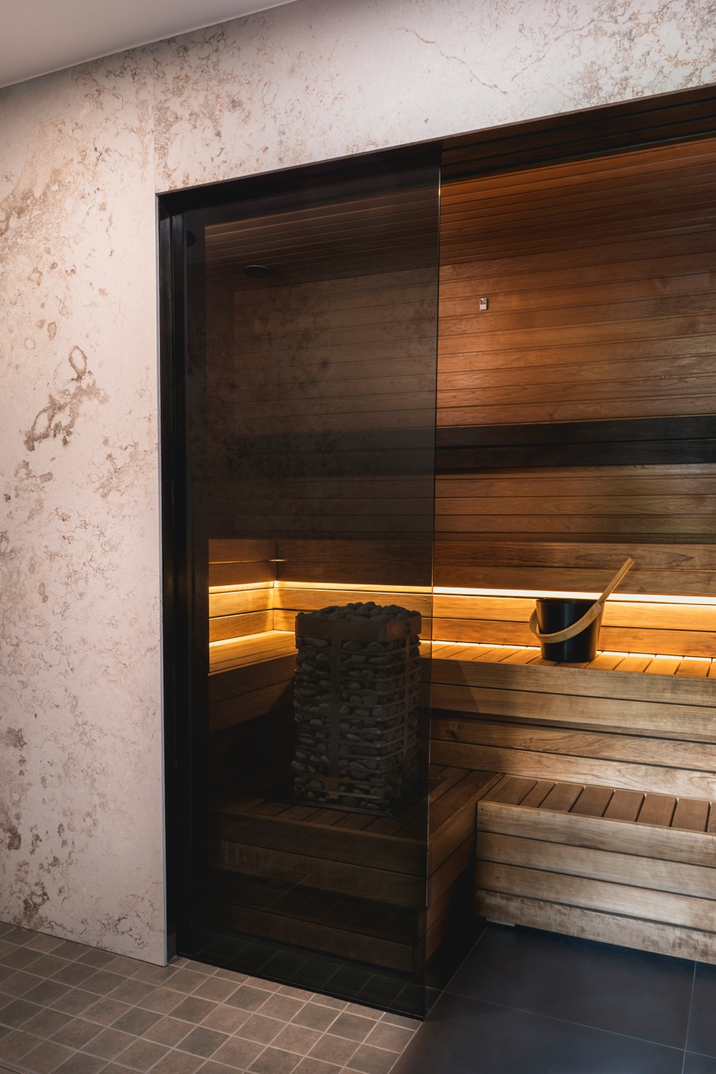 Built-in indoor home sauna with glass front